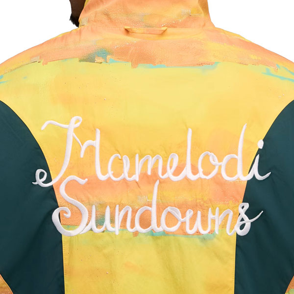 KIDSUPERSTUDIOSマメロディサンダウンズFCリバーシブルジャケットプーマ782754-24サッカー南アフリカレプリカジャケットサポーターグッズ